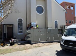 a white van parked in front of a church