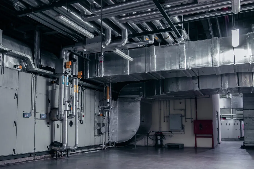 a large industrial building with a bunch of pipes